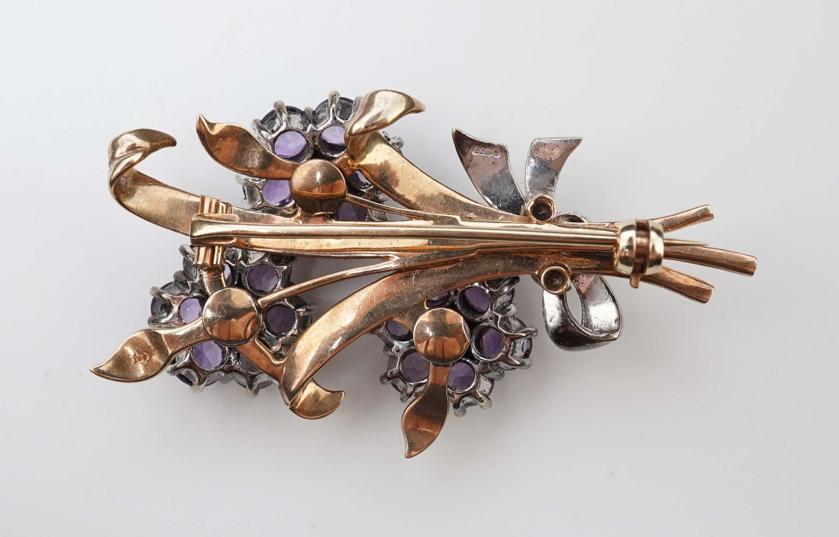 A Retro amethyst and diamond brooch, circa 1956